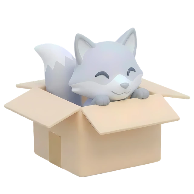 Kitsune, the Snowkit fox, sitting in a cardboard box